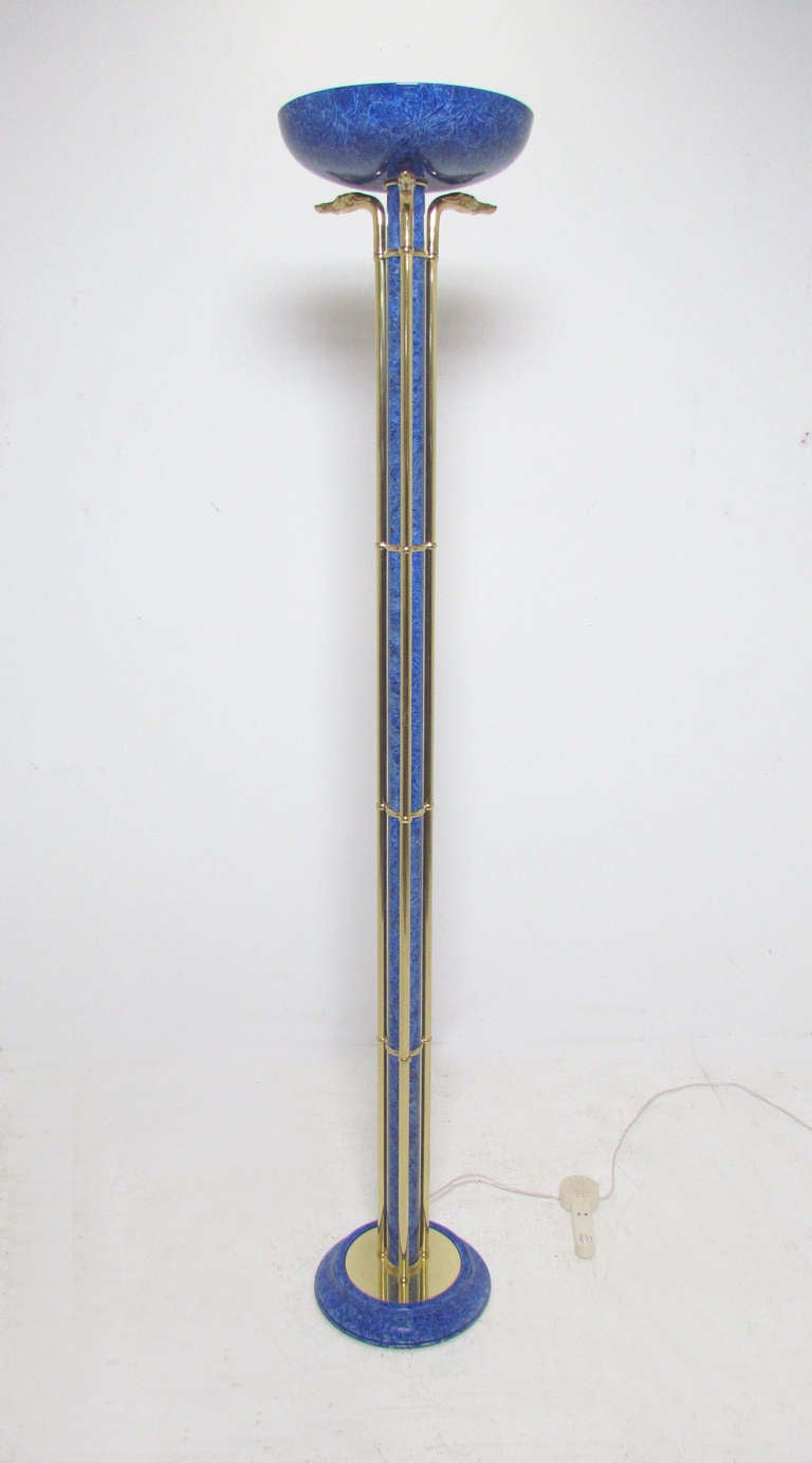 Extraordinary Italian floor lamp in an electric blue faux lapis enamel with brass rails topped by carved whippet heads surrounding the shade.  Wonderful example of the early 1980s neo-classical revival style. Unsigned, save for a footswitch designed
