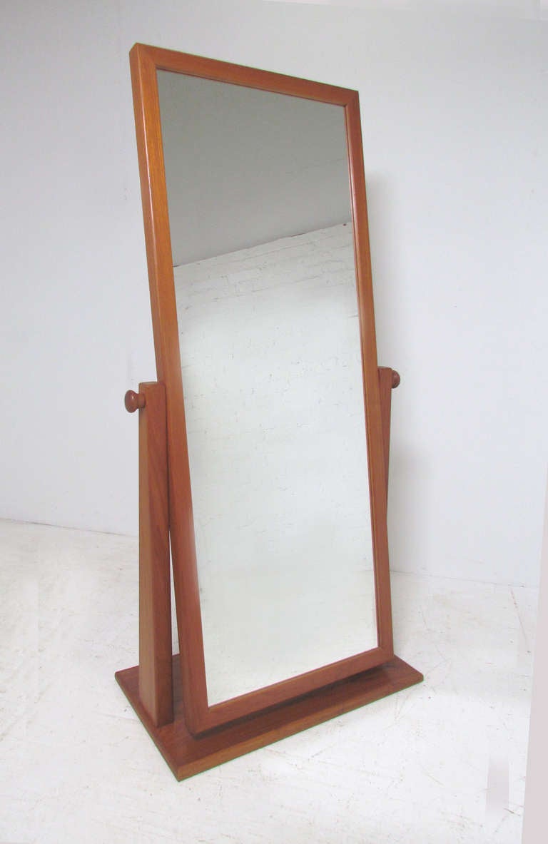 Generously proportioned Danish teak full length cheval mirror, adjustable to any angle.  Fully finished teak back, this can float in a room if desired.   Unmarked, attributed to Pedersen & Hansen which manufactured other cheval and table mirrors