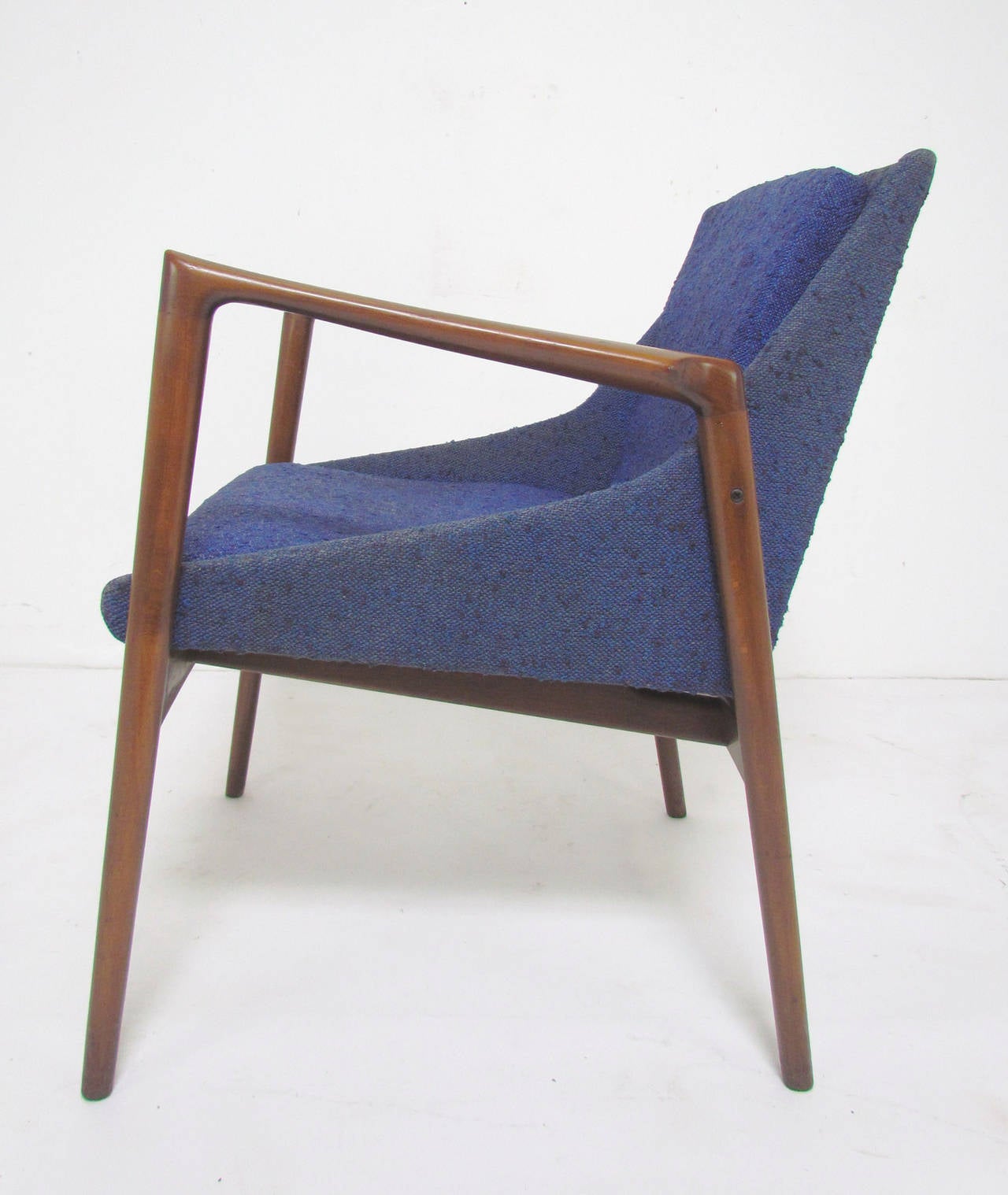 Danish lounge chair with sculptural arms designed by Ib Kofod-Larsen for Selig, circa 1960s.