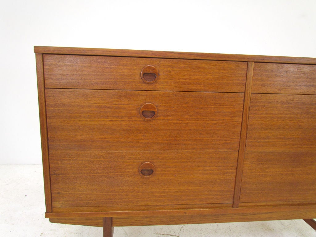 Scandinavian modern teak buffet server with carved round pulls by Dux, made in Sweden, ca. 1960s. Measures 47 3/4