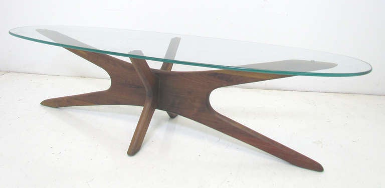 Sculptural walnut coffee table with original oval surfboard glass top by Adrian Pearsall for Craft Associates, ca. 1960s.