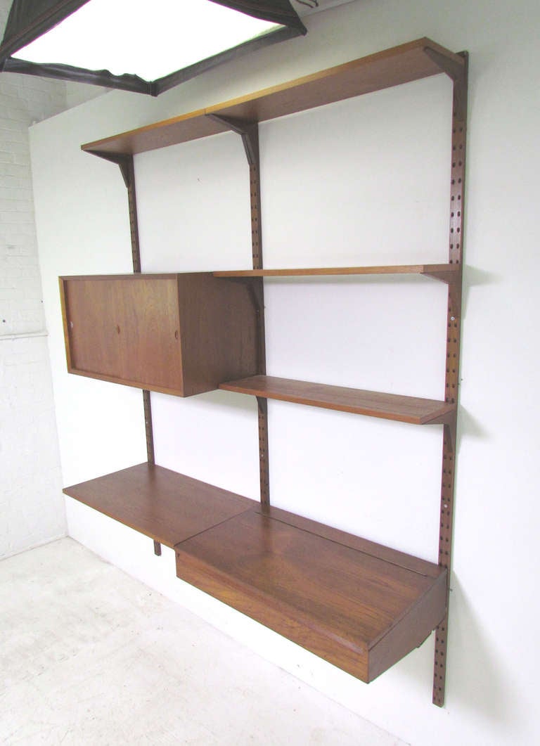Danish Teak Wall Mounted Shelving Unit by Poul Cadovius (Cado) at 1stDibs