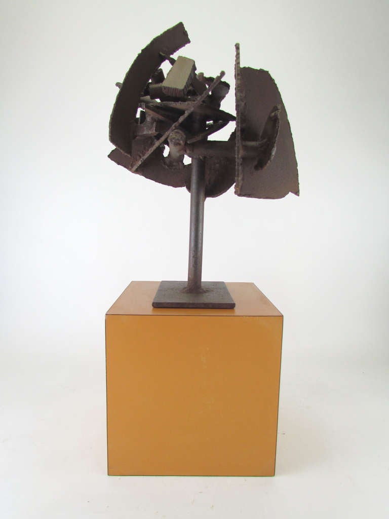 Abstract Brutalist sculpture of torch cut and welded steel ca. 1960s.  Offered as found, resting on (but not affixed to) orange laminate 8