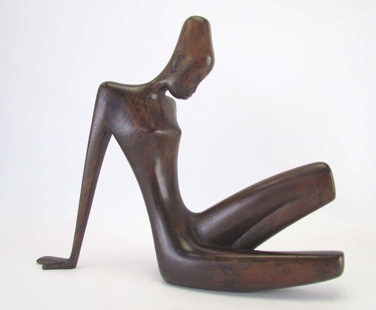 Mid-Century Hagenauer Werkstatte sculpture of a reclining African woman, carved in wood.    Stamped with studio mark 