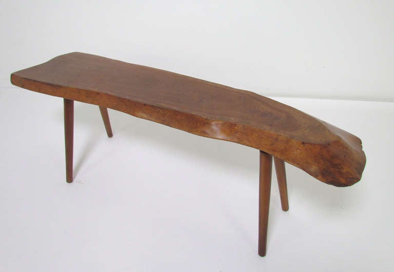 Free form edge studio coffee table by important Vermont-based studio wood worker Roy Sheldon ca. 1960s.  Cherry top and legs, signed with label and with additional notations in pencil 