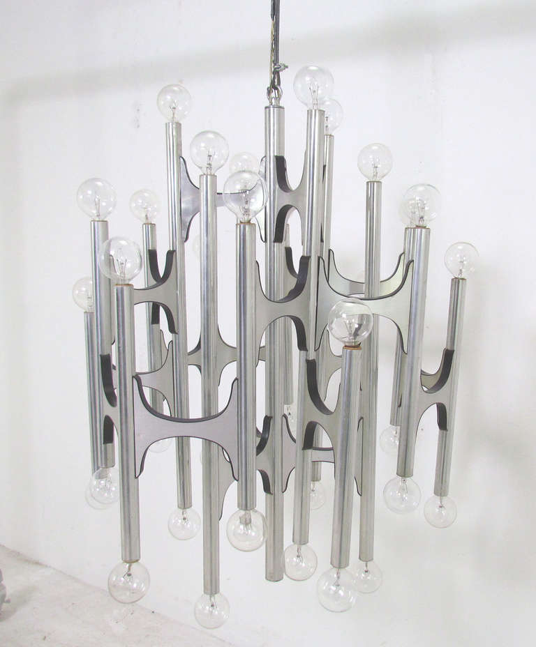 Large modernist thirty-six bulb chandelier by Gaetano Sciolari for Lightolier, ca. early 1970s.  A classic architectural design that offers both upward and downward facing light, creating an enormous focal presence.