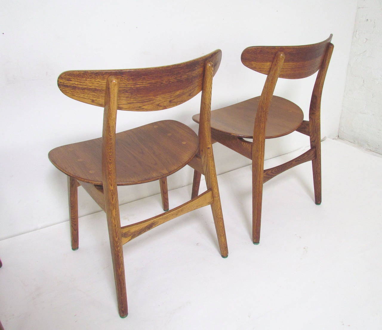 Set of Four Danish Teak and Oak Dining Chairs by Hans Wegner, circa 1960s In Good Condition In Peabody, MA