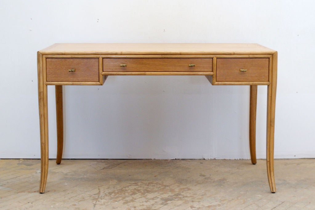 Graceful writing desk with brass pulls designed by Barbara Barry for McGuire, in white oak with brass pulls, ca. 1970s.
