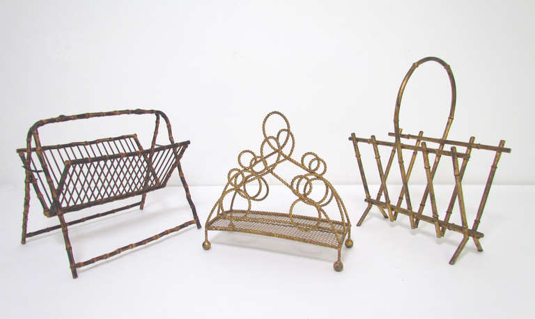 Collection of three classic Hollywood Regency style magazine holders.  On the left, a bent (real) bamboo folding magazine rack, ca. 1940s (19.5