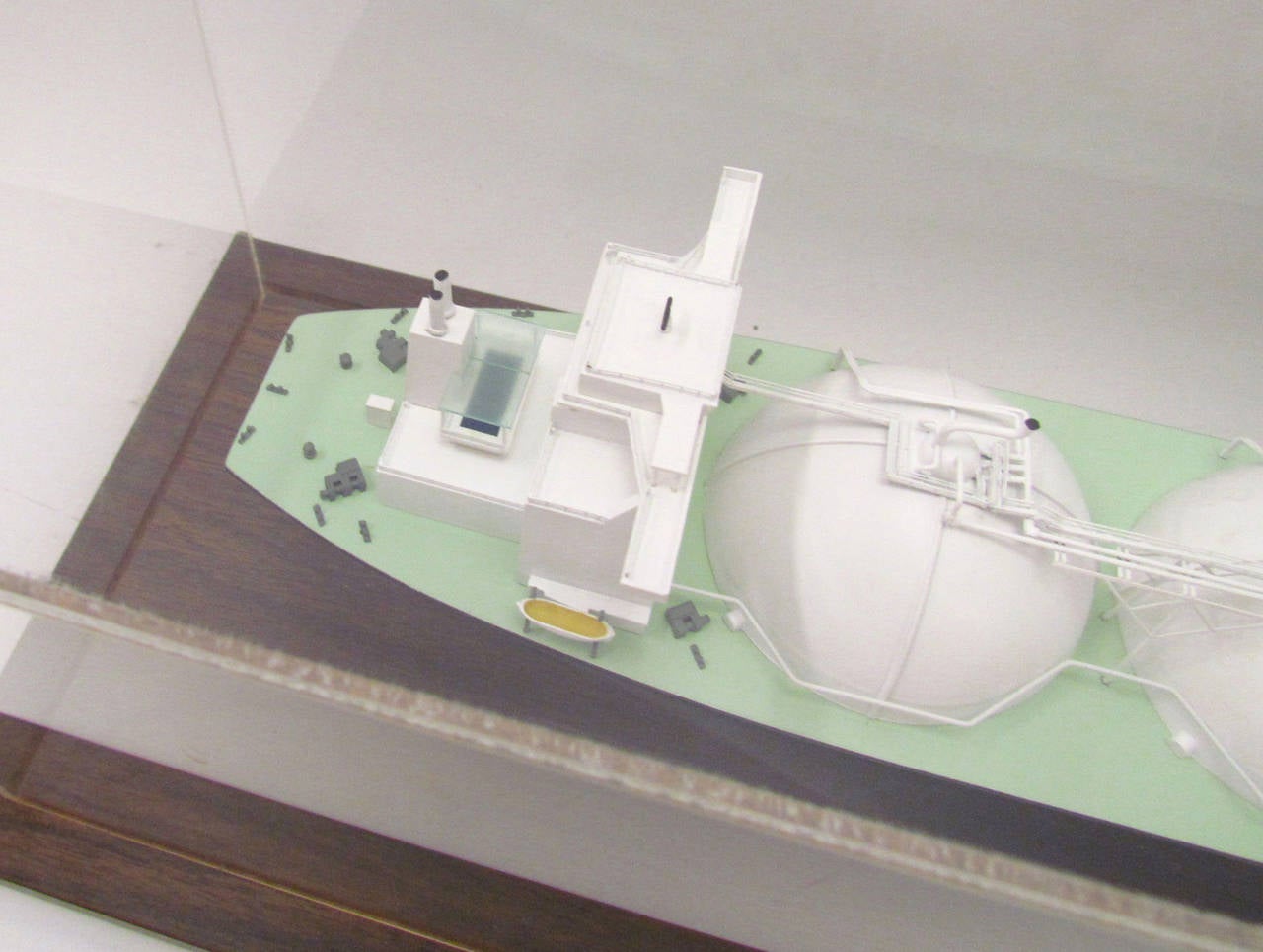 From the estate of a former executive of General Dynamics at the long closed historic Fore River shipyards in Quincy, MA, a presentation model of one of the last line of ships produced there in the 1980s, an LNG (Liquified Natural Gas) tanker. 