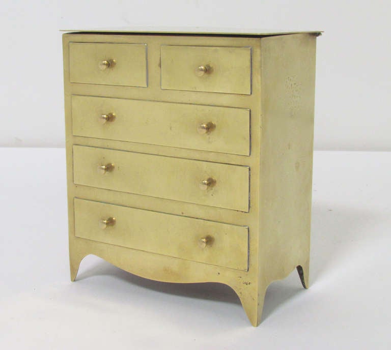 Solid brass desktop storage box in the form of a chest of drawers, signed Sarreid Ltd, made in Italy.