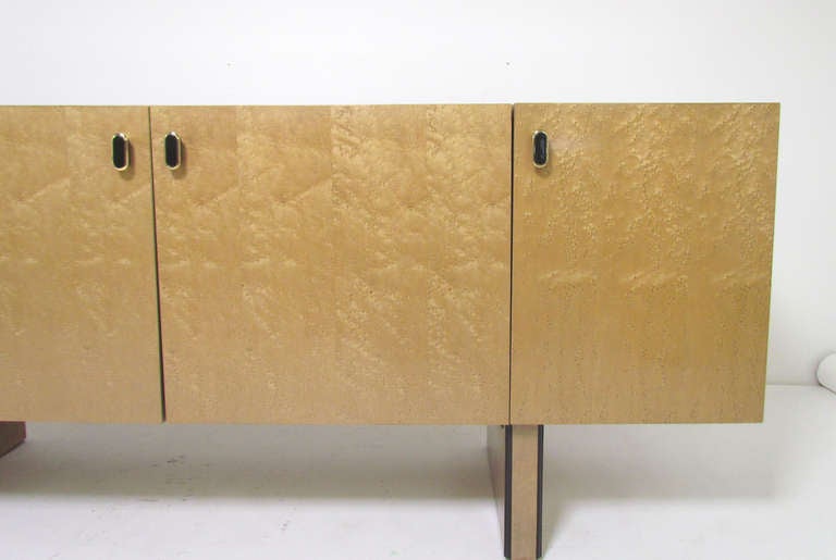 Midcentury credenza in natural burled maple by furniture maker Bernhardt for their high end Flair Division, in the manner of Milo Baughman.  Although there is no evidence that Baughman designed for Bernhardt, this piece demonstrates the enormous