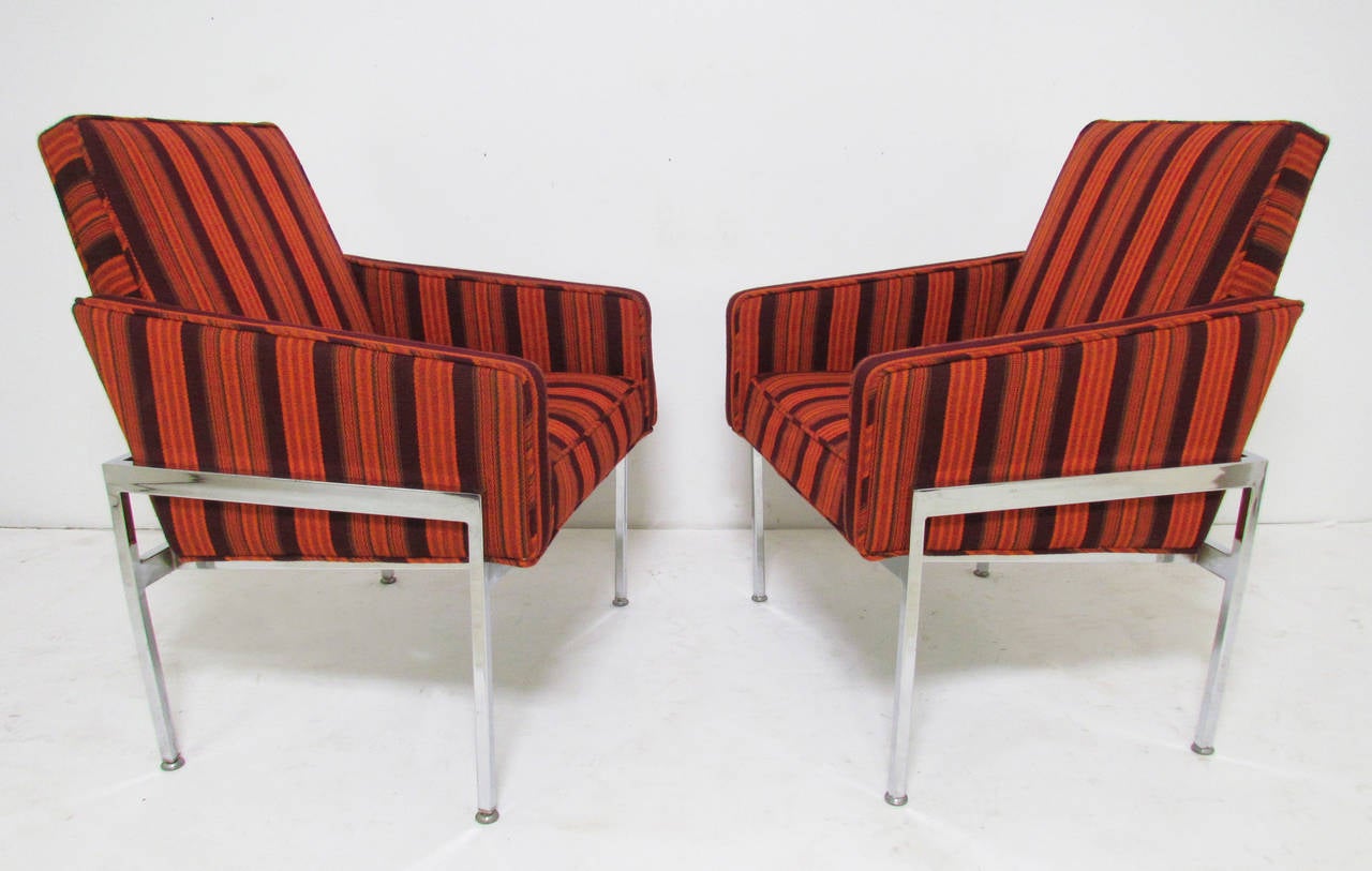 Pair of lounge chairs in striped upholstery with chromed steel frames, in the manner of Milo Baughman.