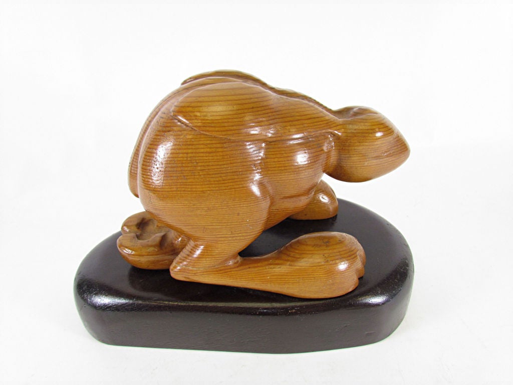 Carved wood sculpture of a handsomely muscular running hare, ca. 1960s.