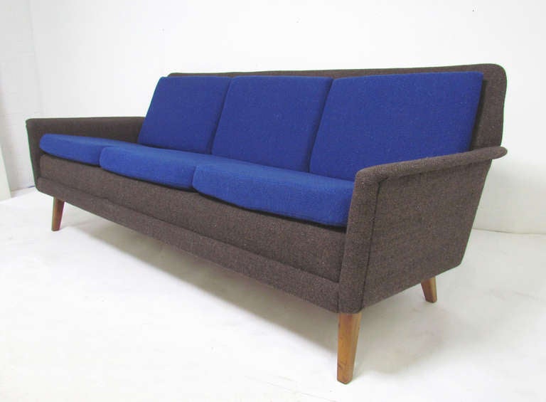 Three seat sofa with flared arms, designed by Folke Ohlsson for Fritz Hansen, Denmark, ca. 1950s.