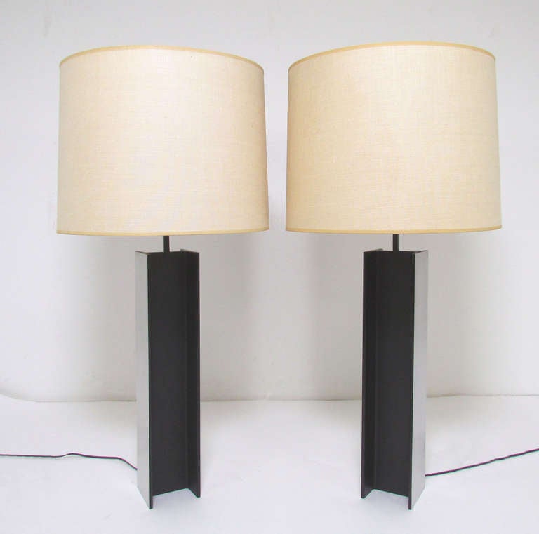 Pair of classic industrial I-Beam table lamps in brushed aluminum and black enamel by Laurel Lighting Co, with original shades, circa 1960s.  The shades are in fine condition and are of perfect proportion for the bases.<br />
<br />
These impressive