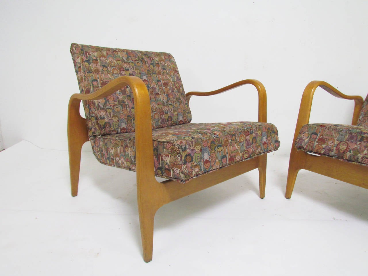 Pair of sculptural lounge armchairs with bent ply birch frames and elegantly tapered legs. Unmarked, but most likely by Thonet.