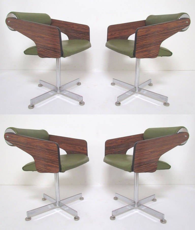 Set of four stylish swivel dining chairs designed in the mid-1960s by Luigi Tiengo for Samton Furniture of Montreal, Canada. Tiengo created many award winning designs in Canada in the 1960s and 70s before pursuing a career as a successful fine