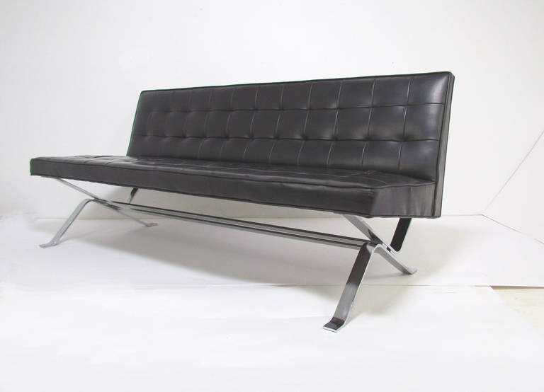 A rare sleek armless sofa with chromed steel base by Herbert Hirche, Germany, ca. 1950.  Hirche was a student of Wassily Kandinsky and Ludwig Mies van der Rohe at the Bauhaus School.  This early post-war design demonstrates an historic transition