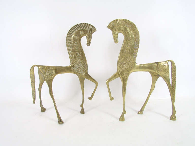 Pair of Etruscan horse sculptures in cast bronze, ca. 1960s, in the manner of Fredrick Weinberg.

One measures 10.5
