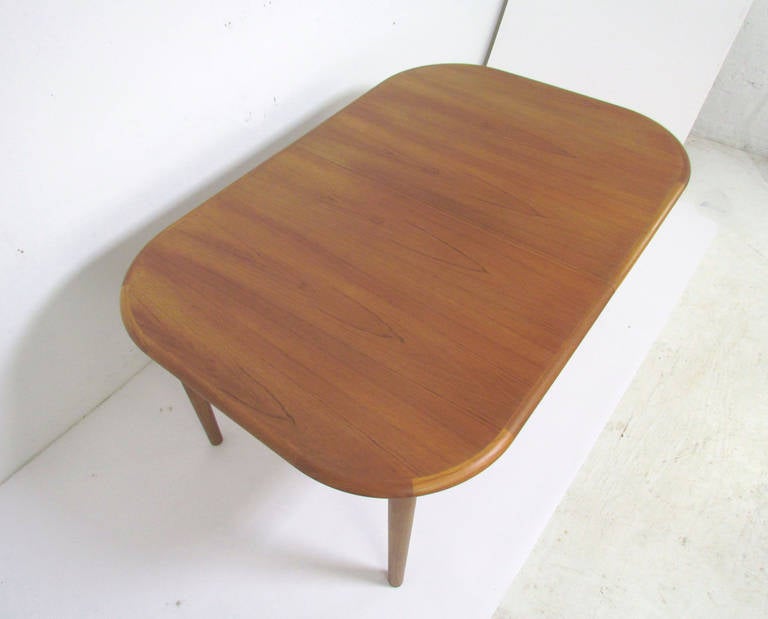 Scandinavian Modern Danish Teak Oval Dining Table with Butterfly Extension Leaf