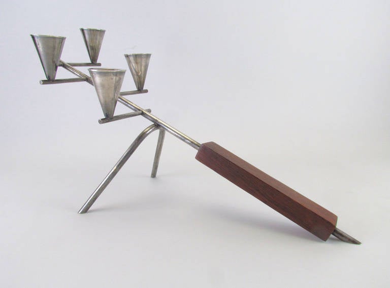 Elegant mid-century modern table top candleholder in silver plate with rosewood handle by silversmith Carl F. Christiansen, Denmark, circa 1950s.     Fully hallmarked.