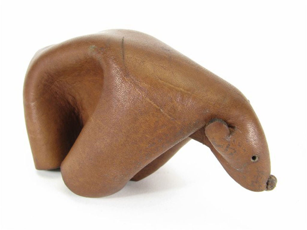 Handcrafted leather bear by Deru, Germany, ca. 1960s.  Deru created its creatures from a single piece of leather, through precision cutting and folding, fastened together by a single rivet.