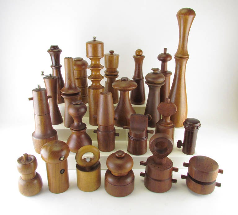 A collection of twenty-three Danish Modern pepper mills circa 1960s-1970s.  The vast majority are teak, designed by Jens Quistgaard for Dansk.  Included are two unsigned Danish designs in rosewood, and one mill by Dan Droz for Lauffer, and one of