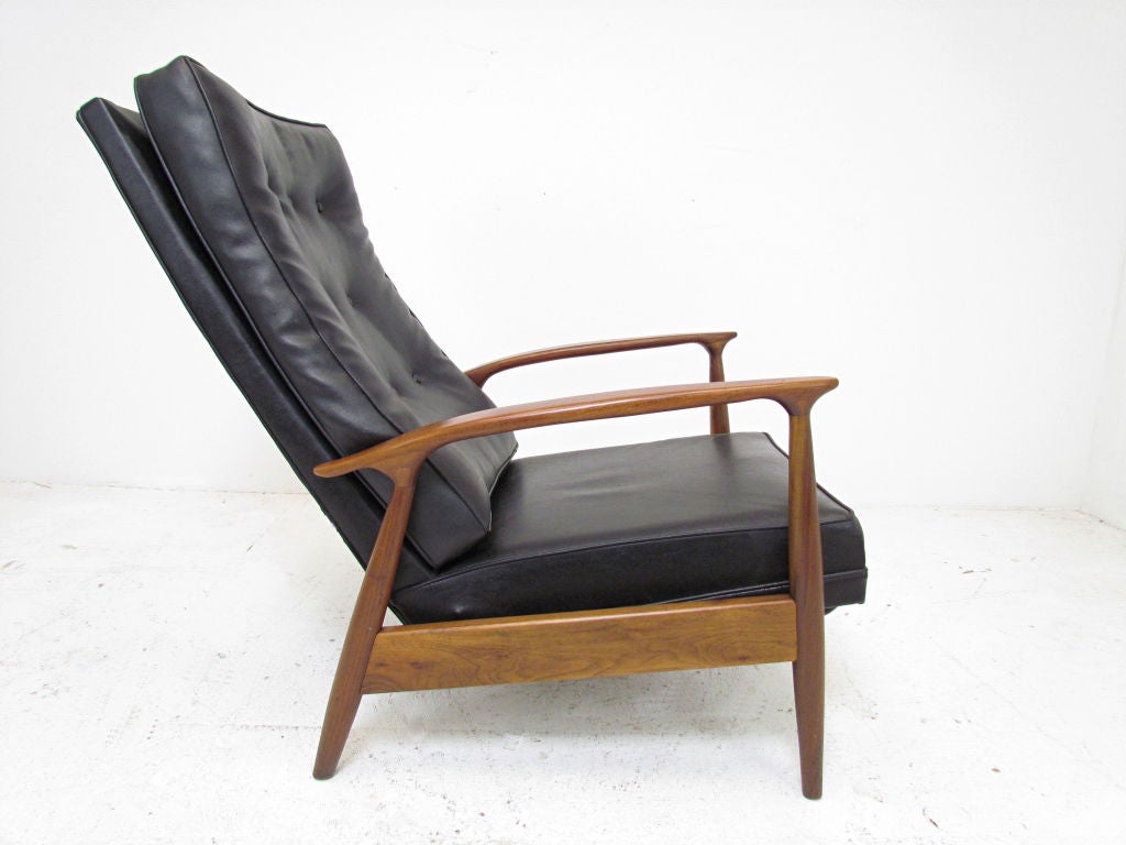 Mid-Century recliner by Milo Baughman, ca. 1960s.  With two reclining positions.   Sculptural walnut framework, original upholstery.