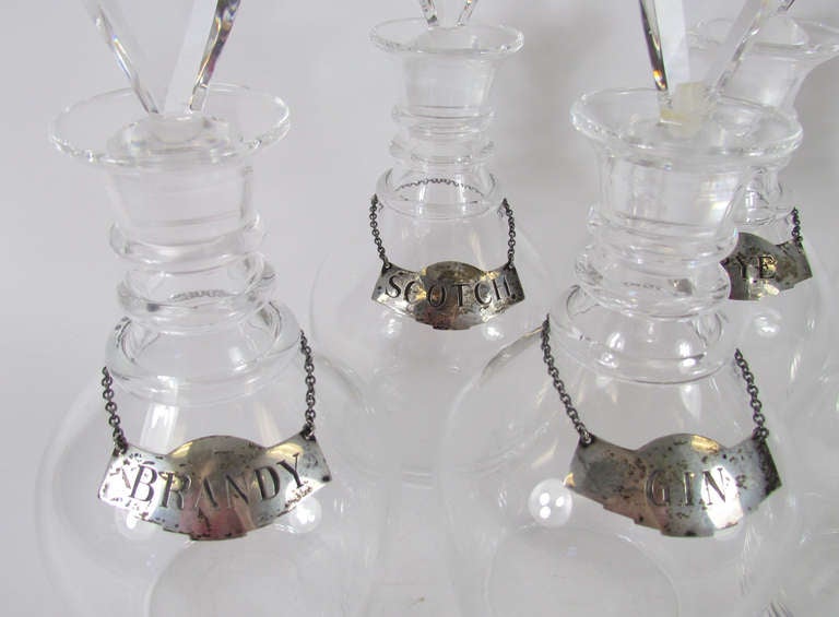 American Set of Six Blown Glass Liquor Decanters by Steuben with Sterling Silver Collars