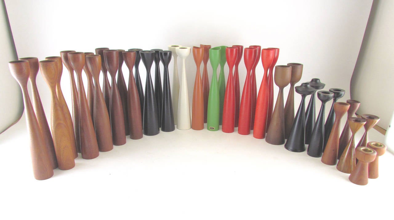 Collection of twenty pairs of mid-century turned wood Danish candleholders, ca. 1960s, of various shapes and sizes.  Some are in solid teak, showing their natural grain. Others with lacquered finishes.   Vary in size from 3.5