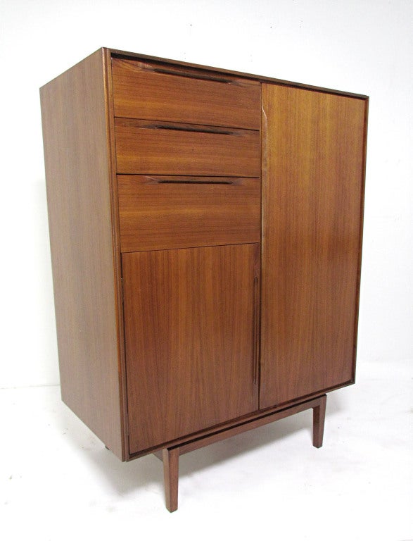 Danish teak gentleman's dresser by Ib Kofod-Larsen for Fredericia Furniture, Denmark, ca. 1960s.  A matching long low dresser from the same series is also available.