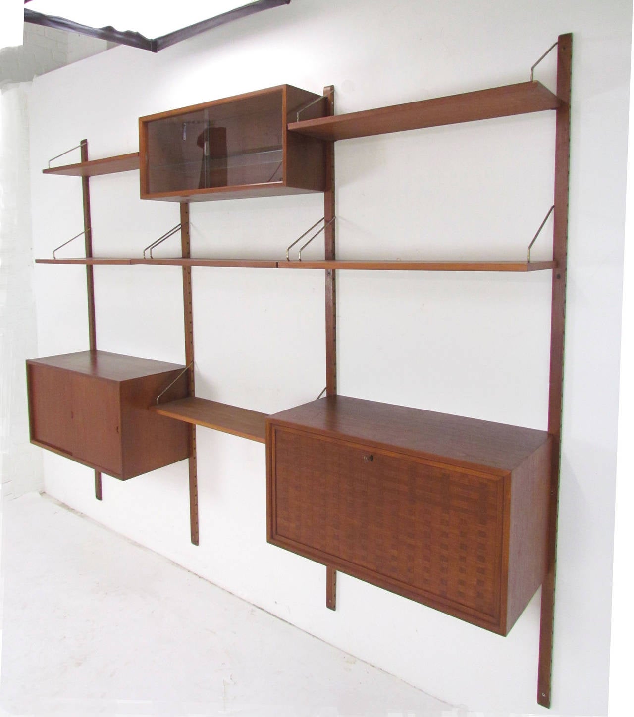 Danish Teak Wall-Mounted Shelving Unit by Poul Cadovius (Cado)