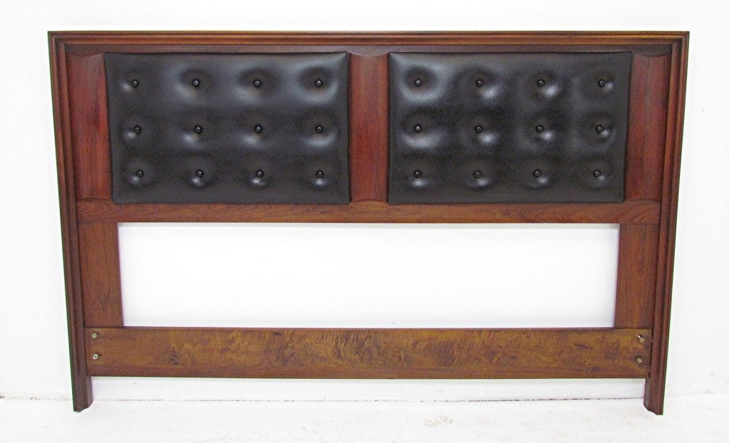 Mid-Century modern headboard for a queen size bed, by John Keal for Brown-Saltman, ca. 1960s.  Sculptural walnut  frame with two upholstered panels.