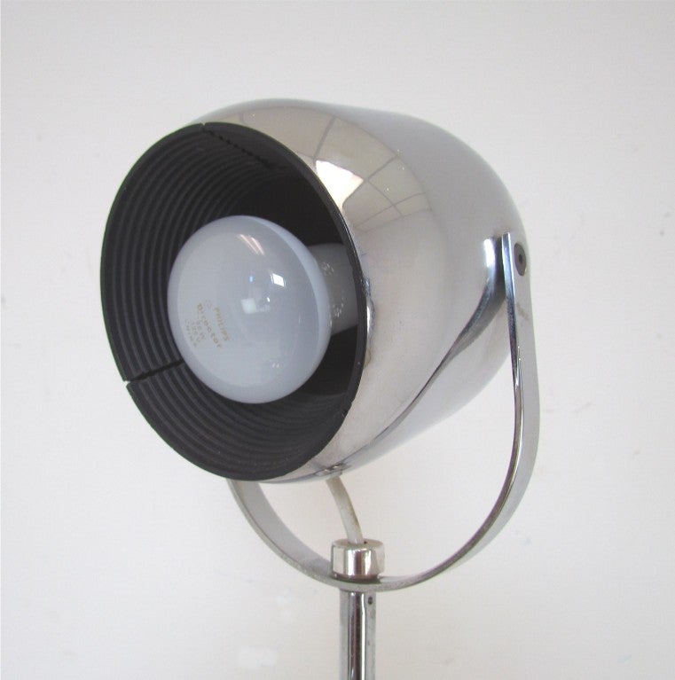 Italian floor lamp with four arms featuring adjustable pivoting spots in chromed steel, by  Reggiani, ca.1970s.  Signed.