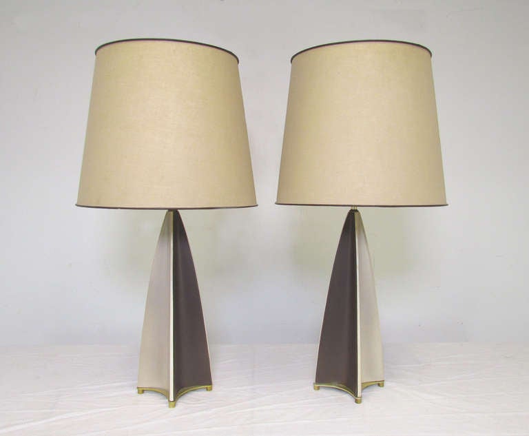 Among the pinnacle of American mid century modern lighting classics, this pair of harlequin table lamps were designed by Gerald Thurston for Lightolier, circa 1950's.  With original period shades.

36.5