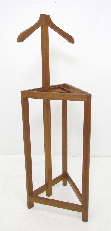 Danish Modern teak valet stand, with coat hanger, two rails to drape pants and ties, and tray for accessories.