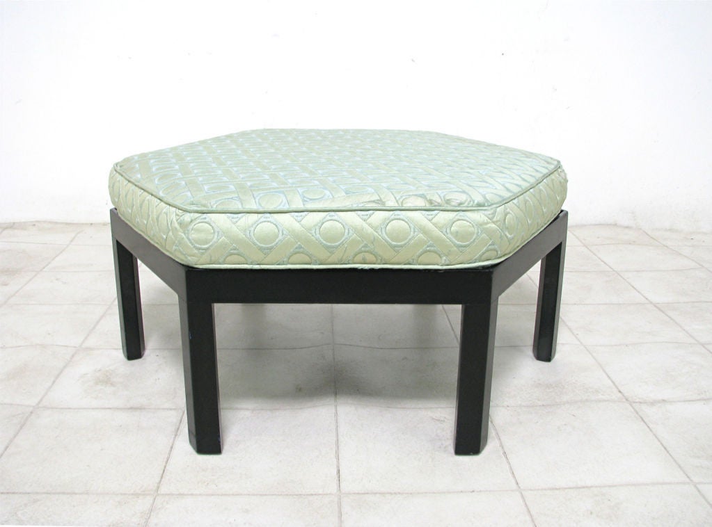 Hexagonal form pouf in ebonized wood by Harvey Probber, ca. 1960s.         29 ½” wide at its widest points, 26” wide from midpoint of a side to the midpoint across.   14” high with cushion, 10 ½” high without cushion.