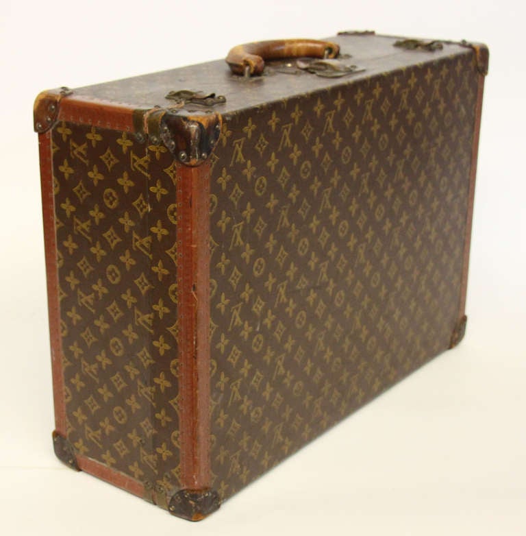 Circa 1930's Louis Vuitton suitcase with all original leather and hardware. Perfectly weathered exterior and clean white canvas interior. 

*Not available for sale or to ship in the state of California.