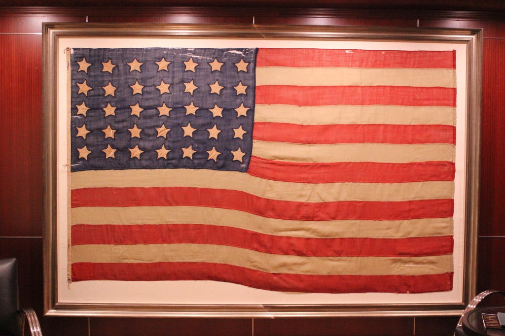 35 Single appliquéd Stars, entirely hand-sewn, civil war period, 1863-65, West Virginia Statehood. 

The stars are made of cotton and single-appliquéd. The stripes and canton of the flag are made of wool bunting. There is coarse linen binding with