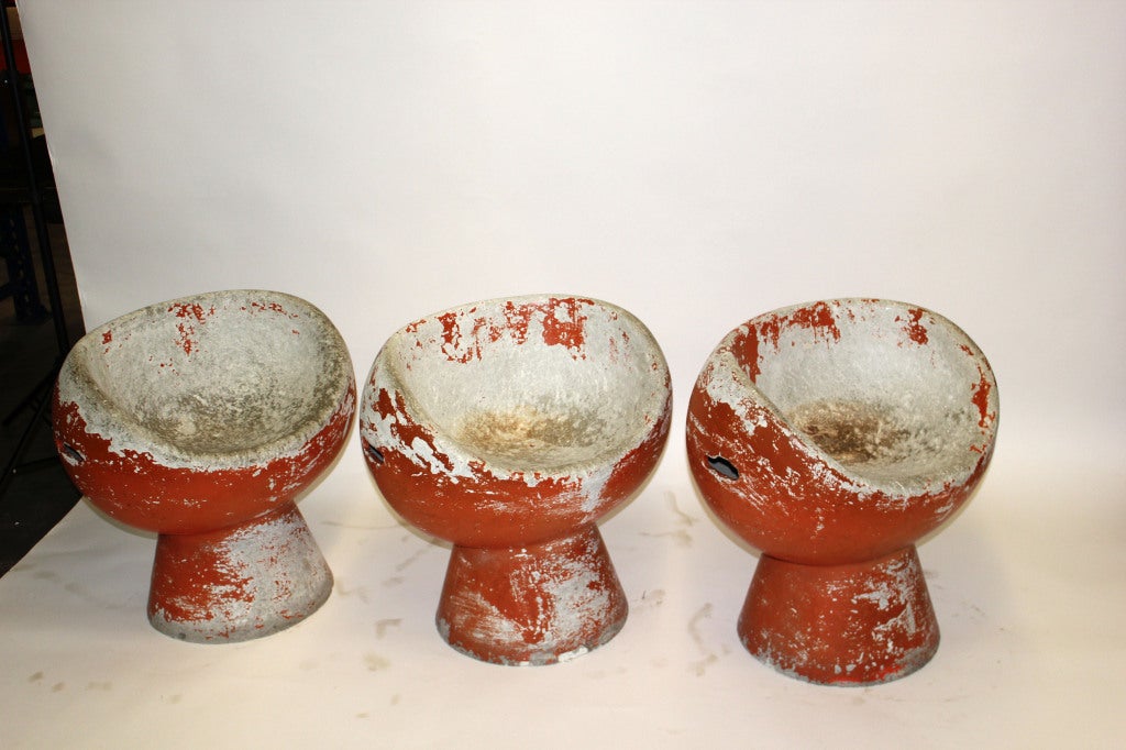 Set of three concrete oviform seats on conical shaped bases. Each seat includes side handles and desirable red patina.

Not available for sale or to ship in the state of California.