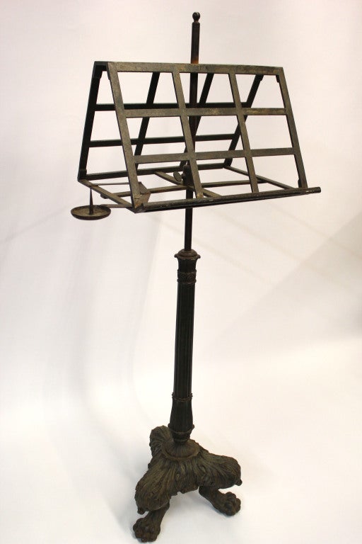 Double sided and adjustable book or music stand. Detailed claw foot tripod base. Movable candleholder allowing user to see by candle light.

Not available for sale or to ship in the state of California.