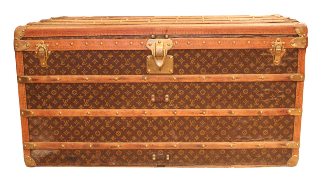 Authentic Louis Vuitton Steamer Trunk with hand-woven brown monogrammed canvas fabric, beech wood slats, polished brass hardware exterior and linen lined interior. This trunk also displays a unique 