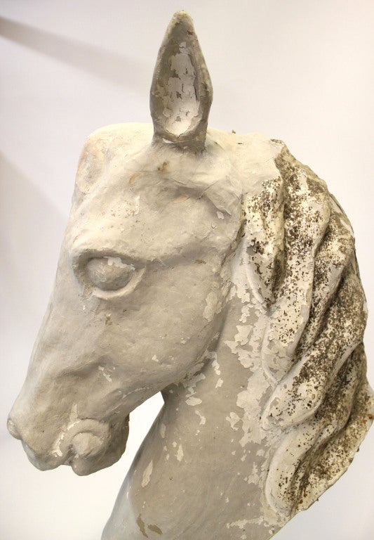 Horse head sculpture made entirely from paper. Sculpture is attached to a wooden base as seen in image 7.