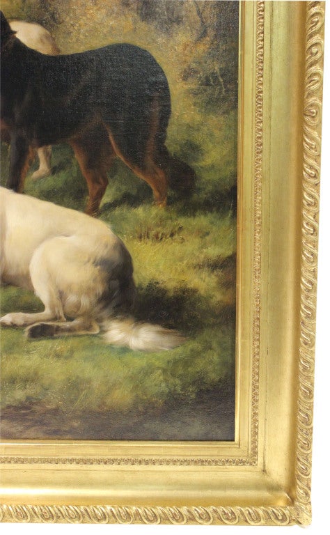 Hunting dogs at rest in English country landscape in a gilt frame.

*Not available for sale or to ship in the state of California.