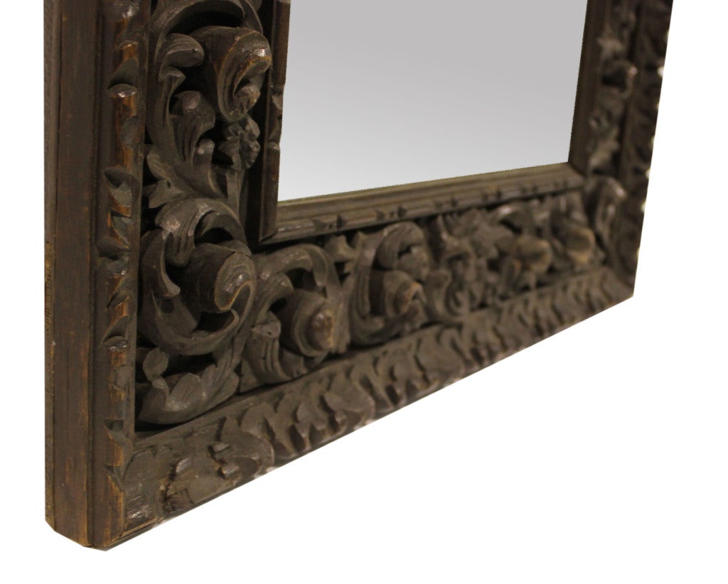 Extremely detailed hand-carved wall mirror.

Not available for sale or to ship in the state of California.