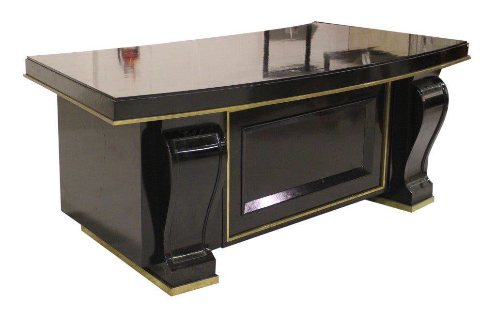 Black lacquer writing desk with brass detail trim throughout. Functional locking doors and desk drawer.

*Not available for sale or to ship in the state of California.