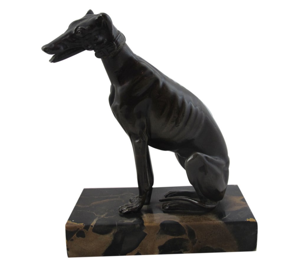Bronze whippet card holder (cards go into dog's mouth) on
marble base. English, circa 1920.