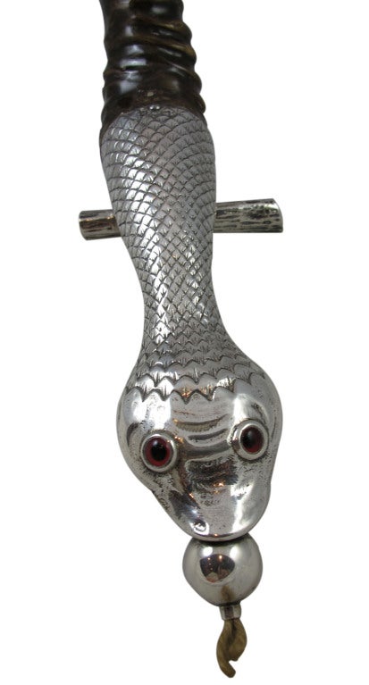 Rare and collectable sterling silver snake lighter with staghorn handle and amber glass eyes, hallmarked, London, 1905.

*For decorative purposes only.
*Not available for sale or to ship in the state of California.