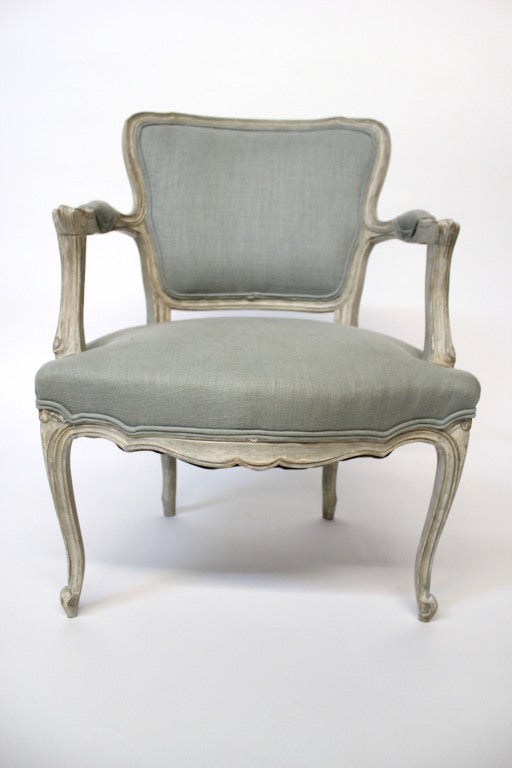 19th century Louis XV style Fauteuil with painted wood frame and upholstered in linen. Very sturdy with beautiful patina throughout.

Not available for sale or to ship in the state of California.